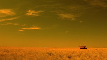 Movie still from “Breaking Bad” (2008), created by Vince Gilligan – A lone person standing in the middle of an open field; Extreme Wide shot, Low angle