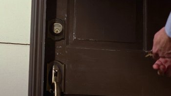 Movie still from “Breaking Bad” (2008), created by Vince Gilligan – A door with a lock on it; Extreme Close Up shot, High angle
