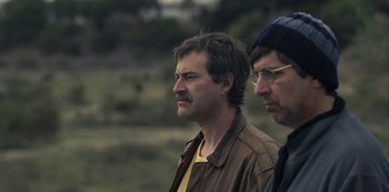 Movie still from “Paddleton” (2019), directed by Alex Lehmann – Two men standing next to each other on a field; Close Up shot, Low angle