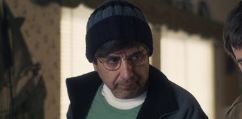 Movie still from “Paddleton” (2019), directed by Alex Lehmann – A person wearing glasses and a hat; Close Up shot, Over the shoulder angle