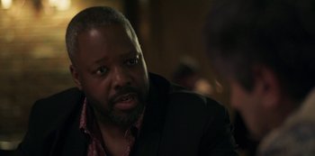 Movie still from “Paddleton” (2019), directed by Alex Lehmann – A man in a black jacket is talking to a woman; Close Up shot, Over the shoulder angle