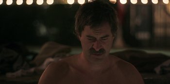 Movie still from “Paddleton” (2019), directed by Alex Lehmann – A man with a mustache is looking down at his face; Close Up shot, Over the shoulder angle
