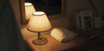 Movie still from “Paddleton” (2019), directed by Alex Lehmann – A table with a lamp on top of it next to a mirror; Extreme Close Up shot, High angle