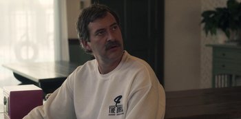 Movie still from “Paddleton” (2019), directed by Alex Lehmann – A person wearing a sweatshirt; Close Up shot, Over the shoulder angle