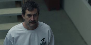 Movie still from “Paddleton” (2019), directed by Alex Lehmann – A person wearing a white shirt; Close Up shot, Over the shoulder angle