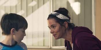 Movie still from “Paddleton” (2019), directed by Alex Lehmann – A woman wearing a head scarf talking to another woman; Close Up shot, Over the shoulder angle