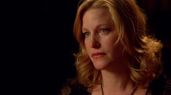 Movie still from “Breaking Bad” (2008), created by Vince Gilligan – A person with blonde hair; Close Up shot, Over the shoulder angle