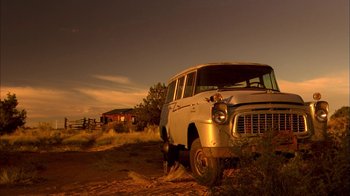 Movie still from “Breaking Bad” (2008), created by Vince Gilligan – An old truck is parked in the dirt; Wide shot, Low angle