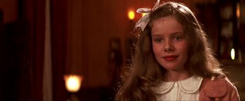 Movie still from “Peter Pan” (2003), directed by P.J. Hogan – A young girl with long hair and a bow in her hair; Close Up shot, Over the shoulder angle