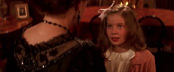 Movie still from “Peter Pan” (2003), directed by P.J. Hogan – A little girl with a bow in her hair; Close Up shot, Over the shoulder angle
