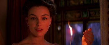 Movie still from “Peter Pan” (2003), directed by P.J. Hogan – A beautiful woman with a candle in her hand; Close Up shot, Over the shoulder angle
