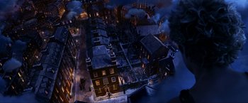 Movie still from “Peter Pan” (2003), directed by P.J. Hogan – An aerial view of a city at night; Extreme Wide shot, Overhead angle