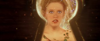 Movie still from “Peter Pan” (2003), directed by P.J. Hogan – A young woman with blue eyes is looking into a mirror; Close Up shot, High angle