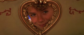 Movie still from “Peter Pan” (2003), directed by P.J. Hogan – A young boy looking into a heart - shaped mirror; Extreme Close Up shot, Low angle