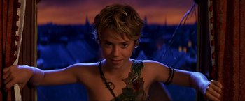 Movie still from “Peter Pan” (2003), directed by P.J. Hogan – A young woman in a peter pan costume; Close Up shot, High angle
