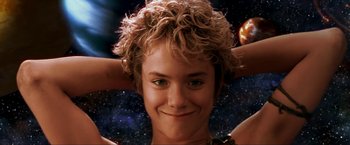 Movie still from “Peter Pan” (2003), directed by P.J. Hogan – A young boy's face in front of a space background; Close Up shot, Low angle