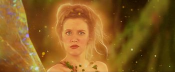 Movie still from “Peter Pan” (2003), directed by P.J. Hogan – A beautiful woman with blonde hair wearing a necklace of green leaves; Close Up shot, Low angle