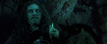 A person holding a lit candle
