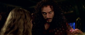 Movie still from “Peter Pan” (2003), directed by P.J. Hogan – A person with long curly hair; Close Up shot, Over the shoulder angle