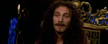 Movie still from “Peter Pan” (2003), directed by P.J. Hogan – A person with a beard and long curly hair; Close Up shot, Over the shoulder angle