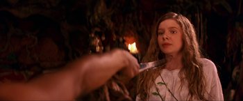Movie still from “Peter Pan” (2003), directed by P.J. Hogan – A woman is holding a knife in front of a man; Close Up shot, Over the shoulder angle