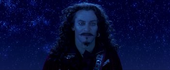 Movie still from “Peter Pan” (2003), directed by P.J. Hogan – A person with long curly hair; Close Up shot, High angle