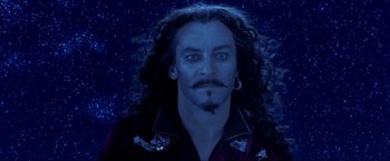 Movie still from “Peter Pan” (2003), directed by P.J. Hogan – A person with long curly hair; Close Up shot, Over the shoulder angle