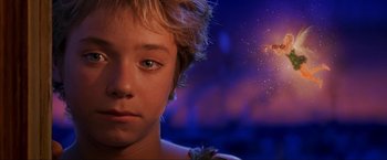 Movie still from “Peter Pan” (2003), directed by P.J. Hogan – A boy's face with fireworks in the background; Close Up shot, Over the shoulder angle