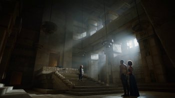 Movie still from “Game of Thrones” (2011), created by D.B. Weiss – Two women are standing on a staircase in a large building; Extreme Wide shot, Low angle