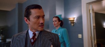 Movie still from “Ratched” (2020), created by Evan Romansky – A man and a woman standing next to each other in a room; Close Up shot, Low angle