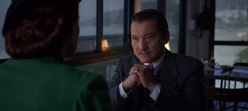 Movie still from “Ratched” (2020), created by Evan Romansky – A man in a suit and tie looking at a woman; Close Up shot, Over the shoulder angle