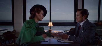 Movie still from “Ratched” (2020), created by Evan Romansky – A woman sitting at a table with a man; Medium shot, Over the shoulder angle