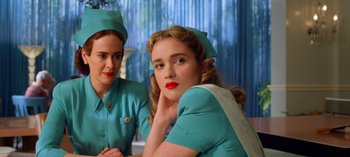 Movie still from “Ratched” (2020), created by Evan Romansky – A woman in a nurse's uniform and a woman in a nurse's outfit; Close Up shot, Low angle