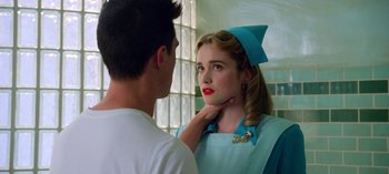 Movie still from “Ratched” (2020), created by Evan Romansky – A young man and a young woman are looking at each other; Close Up shot, Over the shoulder angle