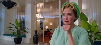 Movie still from “Ratched” (2020), created by Evan Romansky – An older woman in a green shirt is holding a toothbrush; Close Up shot, Low angle