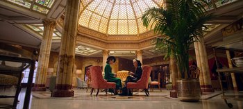 Movie still from “Ratched” (2020), created by Evan Romansky – Two women sitting in chairs in an ornate room; Wide shot, Low angle