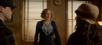 Movie still from “Ratched” (2020), created by Evan Romansky – An older woman standing in front of a mirror; Medium shot, Over the shoulder angle