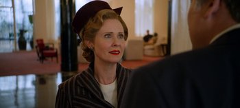Movie still from “Ratched” (2020), created by Evan Romansky – An older woman wearing a hat looking to her left; Close Up shot, Over the shoulder angle