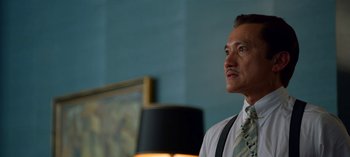 Movie still from “Ratched” (2020), created by Evan Romansky – A man wearing a white shirt and a tie; Close Up shot, Low angle