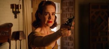 Movie still from “Ratched” (2020), created by Evan Romansky – A woman is holding a gun in a room; Close Up shot, Low angle