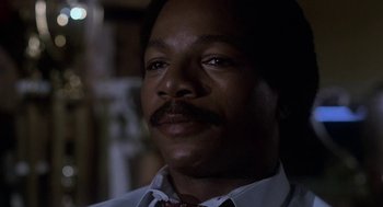 Movie still from “Rocky III” (1982), directed by Sylvester Stallone – A person wearing a shirt and tie; Close Up shot, Low angle