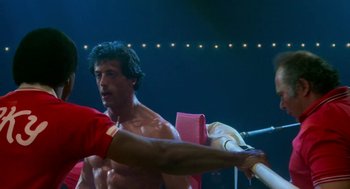 Movie still from “Rocky III” (1982), directed by Sylvester Stallone – Sylvester stallone in a scene from the movie rocky; Medium shot, Over the shoulder angle