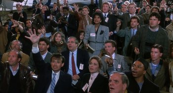 Movie still from “Rocky V” (1990), directed by John G. Avildsen – A group of people sitting in a room with their hands raised; Medium shot, High angle