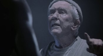 Movie still from “Rocky V” (1990), directed by John G. Avildsen – An old man with a white beard looking into a mirror; Close Up shot, Over the shoulder angle