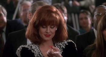 Movie still from “Rocky V” (1990), directed by John G. Avildsen – A person holding a pen; Close Up shot, Over the shoulder angle