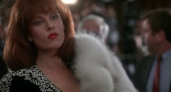 Movie still from “Rocky V” (1990), directed by John G. Avildsen – A person wearing a dress and a fur coat; Close Up shot, Low angle