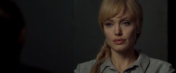 Movie still from “Salt” (2010), directed by Phillip Noyce – A person with a braid; Close Up shot, Over the shoulder angle