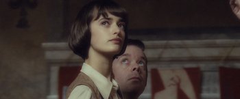 Movie still from “Salt” (2010), directed by Phillip Noyce – A man and a woman are looking up at something; Close Up shot, Low angle