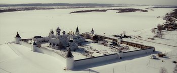 Movie still from “Salt” (2010), directed by Phillip Noyce – An aerial view of a castle in the middle of a snow covered field; Extreme Wide shot, High angle