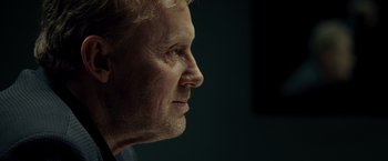 Movie still from “Salt” (2010), directed by Phillip Noyce – An older man's face is shown in profile; Close Up shot, Over the shoulder angle